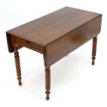 A mid / late 19thC mahogany Pembroke table with a rectangular top above two drop flaps and spiral