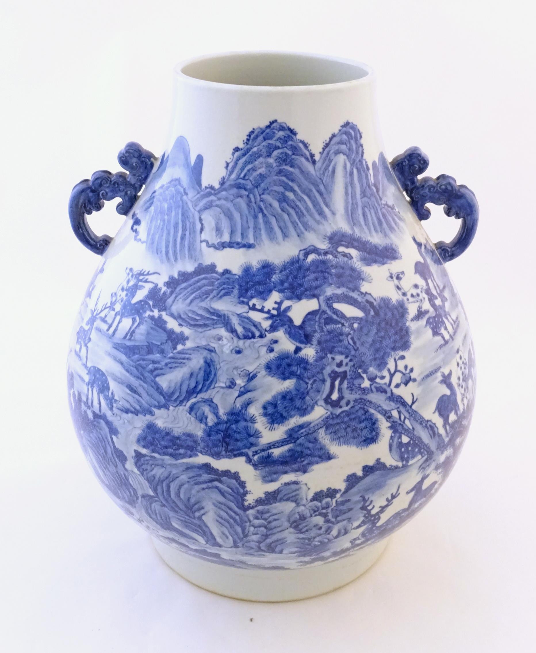 A large Chinese Hu vase with scrolled twin handles, the body decorated in blue and white with the - Image 5 of 9