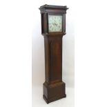 Francis Mee - Higham Ferrers : An oak cased 8-day long case clock with painted break arch 12" dial