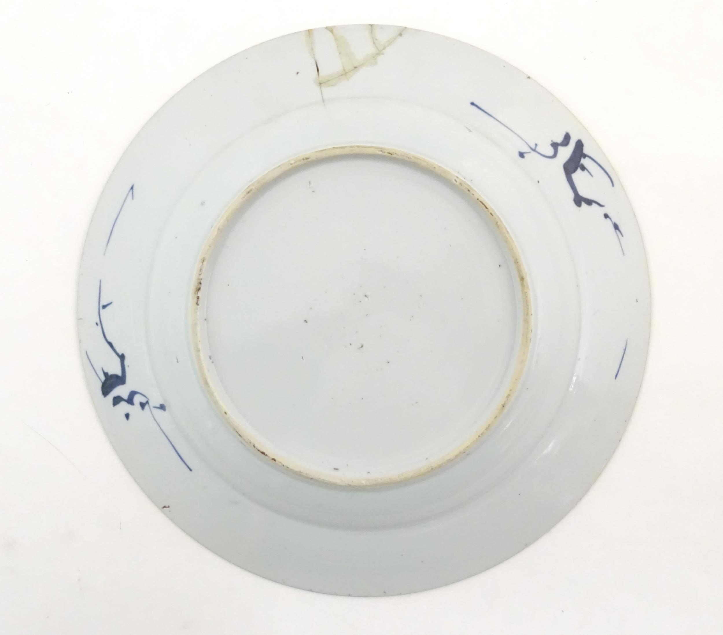 A Chinese blue and white plate decorated with flowers and foliage. With stylised motifs to - Image 4 of 5