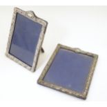 Two photograph frames with silver surrounds having embossed decoration hallmarked Birmingham 1904/