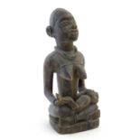 Ethnographic / Native / Tribal: A carved Congo model of a seated woman and child. Approx. 16" high