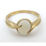 A 9ct gold ring set with central opal cabochon. Ring size approx. P Please Note - we do not make