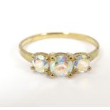 A 9ct gold ring set with three graduated mystic topaz. Ring size approx. P Please Note - we do not