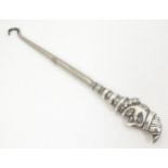A button hook with a novelty silver handle formed as Mr Punch, hallmarked Birmingham 1909, maker