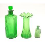 Assorted green glass comprising 2 bottles and a vase with flared rim. The tallest 7" high (3) Please