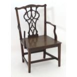 A 19thC mahogany Chippendale child's chair with a shaped top rail, pierced back splat and raised