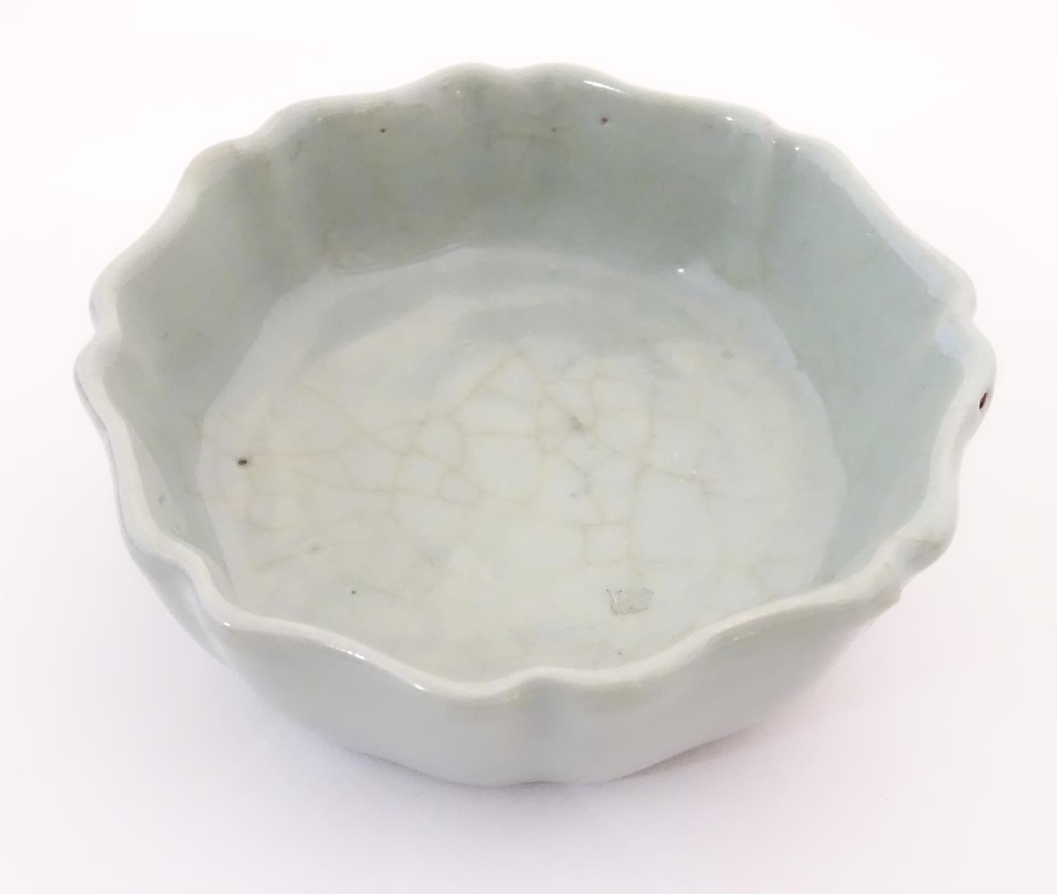 A Chinese celadon brush wash pot with a scalloped edge. Character marks under. Approx. 1 1/2" high x - Image 3 of 5