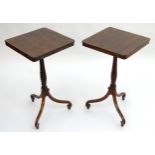 A pair of Regency rosewood wine tables, both having squared tops with moulded edges above spiral