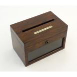 A Victorian rosewood General Post box of rectangular form with a glazed front. The top set with an