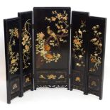 A black lacquered 6 fold oriental screen with hardstone decoration and pierced frame. 47" high.