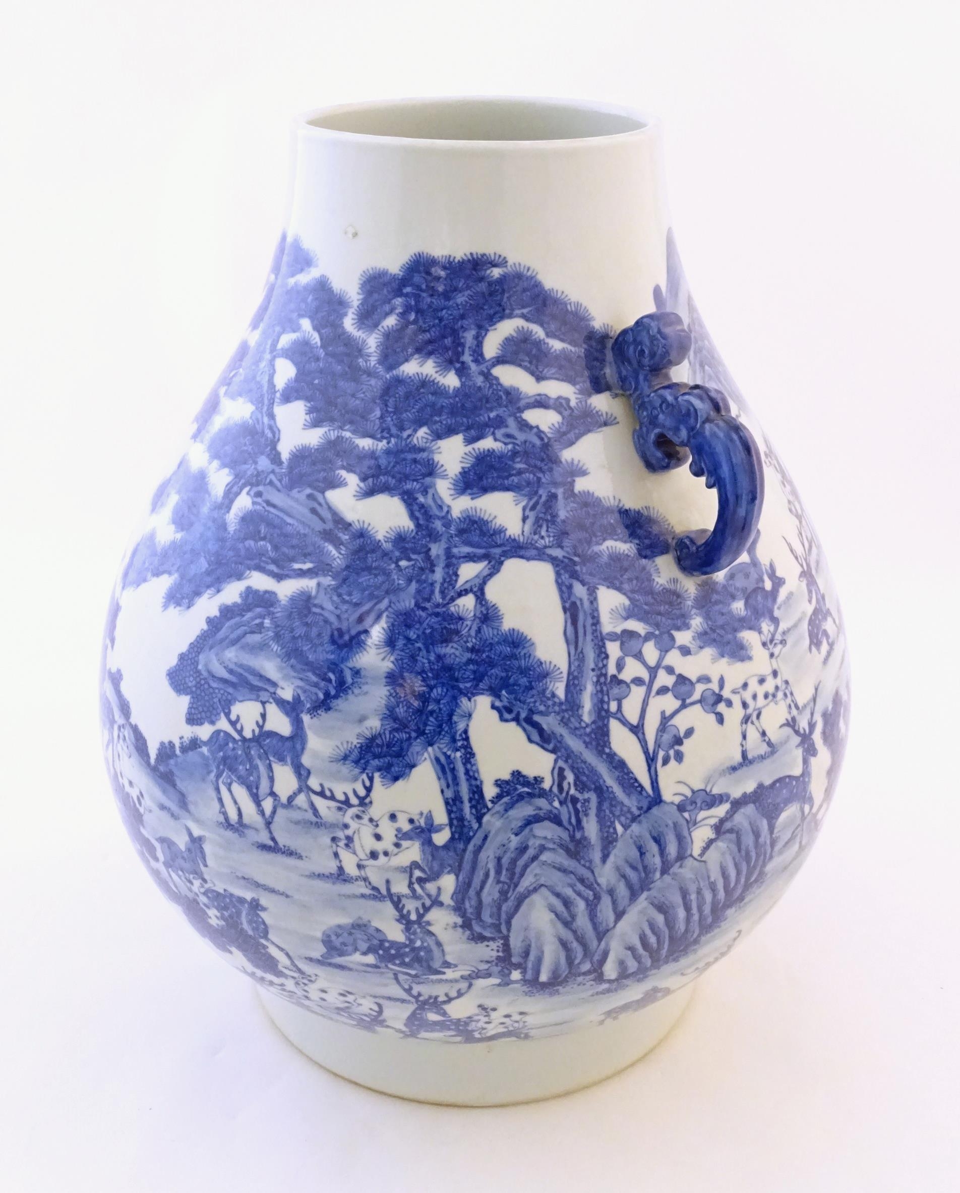 A large Chinese Hu vase with scrolled twin handles, the body decorated in blue and white with the - Image 4 of 9