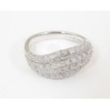 A 9ct white gold ring set with a profusion of diamonds. Ring size approx. O 1/2 Please Note - we