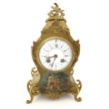 A French 19thC mantle clock decorated in the Vernis Martin style with gilt mounts, enamel dial and