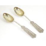 Chinese Export silver - A pair of late 19thC / early 20thC silver spoons with gilded bowls and