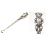 A Button hook, the silver handle modelled as a bear hallmarked Birmingham 1909 maker Crisford &