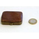 A Victorian small leather coin purse with gilt metal mounts. Approx. 2 1/4" x 1 3/4" Please Note -