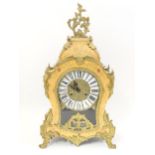 A Louis XIV style ' Le Ore ' mantel clock by Franz Hermle & Sons Approx 22" high. Please Note - we