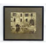 A 20thC black and white photograph depicting two women at the harbour of Punta San Vigilio, Lake