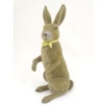 A mid 20thC model of a seated rabbit. Approximately 17" tall Please Note - we do not make