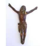 A 19thC Goanese stained ivory Corpus Christi, depicting Christ in the crucifix position. Approx. 6