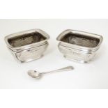 Two silver salts hallmarked Birmingham 1905 maker W & Co Ltd. 2 1/2" wide together with an