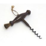 A 19thC corkscrew with turned wooden handle set with brush. Approx. 5 1/2" Please Note - we do not