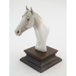 A model of a horse head on stand by Baldrock, Baranite. Approx. 7" high overall Please Note - we