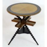 A Victorian gypsy tarot card table with a circular top with an ebonised surround and bobbin turned