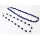 Two bead necklace, one of lpiz lazuli beads with a silver clasp, the other of pearls and lapis