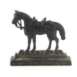 An early 20thC cast door stop / door porter modelled as a horse with saddle and reins. Approx. 7 1/