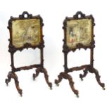 A pair of William IV rosewood fire screens, having floral carved frames and carrying handles to