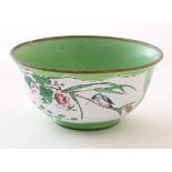 A Chinese / Cantonese famille verte bowl with enamel detail, decorated with a bird on a peony