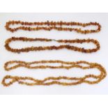 Three various vintage necklaces of amber coloured beads. The longest approx 60" long (3) Please Note