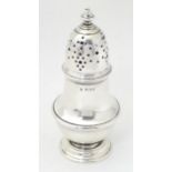 A silver sugar caster, hallmarked London 1928 maker Edward Barnard & Sons Ltd. Approx. 6" high