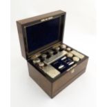 A Victorian ladies vanity / travelling box retailed by Parkins & Gotto, opening to reveal a fitted