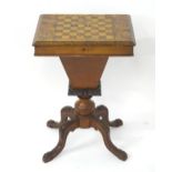 A late 19thC / early 20thC sewing box / work box with a parquetry inlaid lid having sample wood