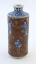 A Chinese snuff bottle with blue and white figures and a mottled ground. Character marks under.