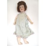 Toy: an early 20thC bisque doll by Herman Steiner , Bavaria. The head with back stamps: 'Made in