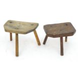 Two early 19thC country made milking stools with canted edges and three turned tapering legs. 16"