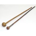Two native tribal ethnographic knobkerrie sticks, the largest approximately 31 1/2" Please Note - we