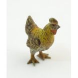 A cold painted bronze model of a chicken / hen. Approx. 7/8" high Please Note - we do not make