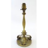 A 20thC brass lamp base with column detail and scrolled supports. Approx. 14 1/2" high Please Note -