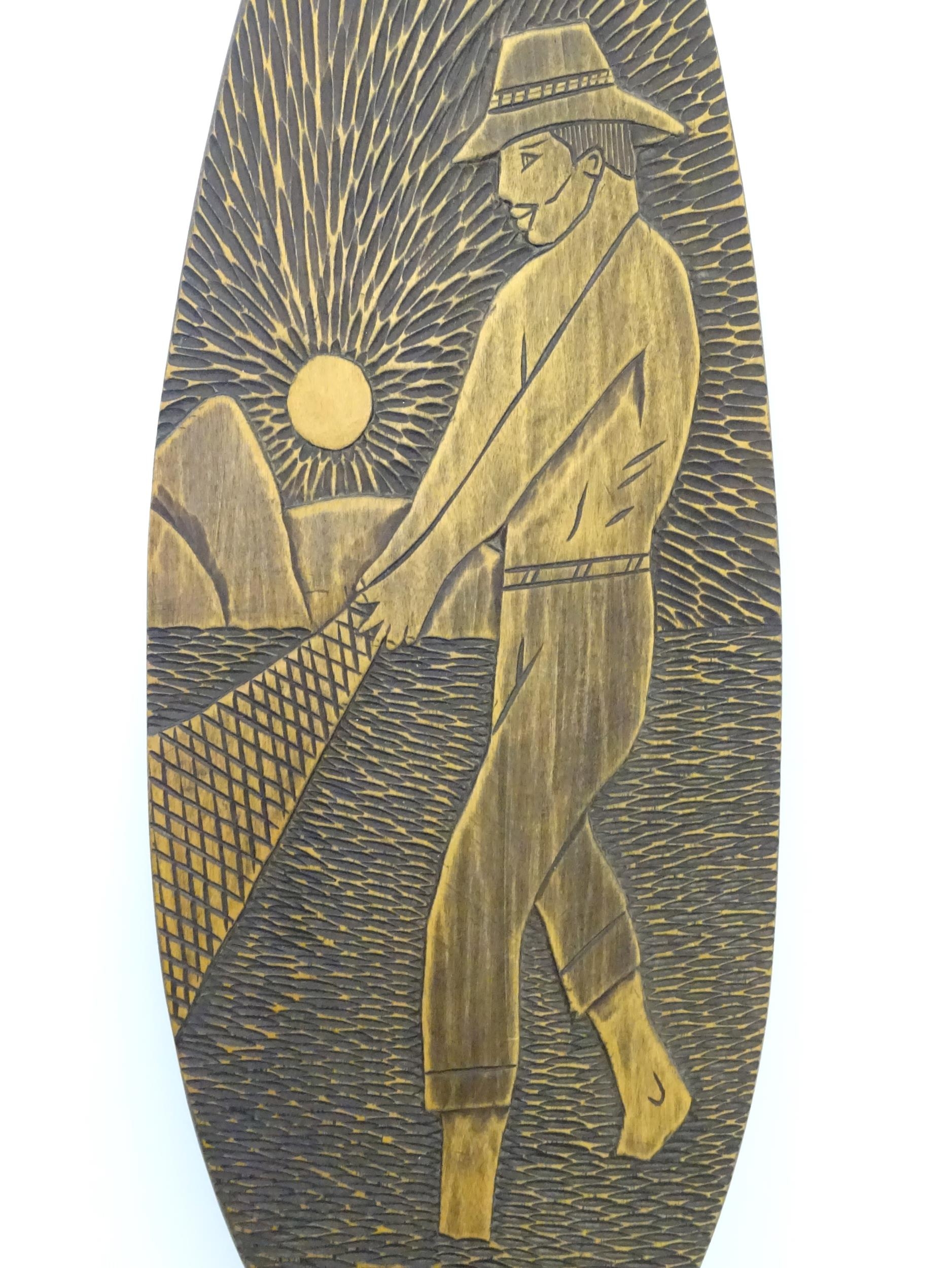 A Brazilian boat oar / paddle with carved decoration a man fishing with a net. Ascribed 'Itatiaia, - Image 6 of 8