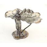 An Art Nouveau WMF silver plate pedestal visiting card tray formed as lily pad and flowers supported