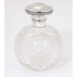 A cut glass scent / perfume bottle with mount and hinged lid, hallmarked Birmingham 1922. Approx.