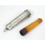 A silver cheroot mouthpiece case with engraved decoration and mouthpiece within, the case hallmarked