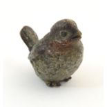 A cold painted bronze model of a song bird. Approx. 1" high Please Note - we do not make reference