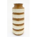 A West German vase with banded detail in relief. Marked under. Approx. 16" high Please Note - we