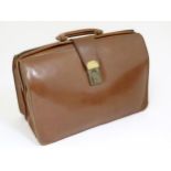 A vintage brown leather satchel style briefcase. Approx. 11" x 17" x 7" Please Note - we do not make